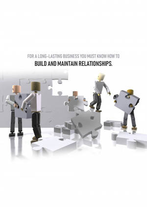 Conceptual image of wooden figures building a puzzle representing business relationships.