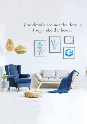 A bright and airy living room with blue and neutral tones, featuring wall art and comfortable seating.