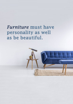 Modern living room interior with a blue sofa, side table, and inspirational quote on the wall.