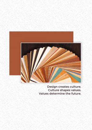 A fan of various wood color swatches displayed on a dark surface with a brown background.