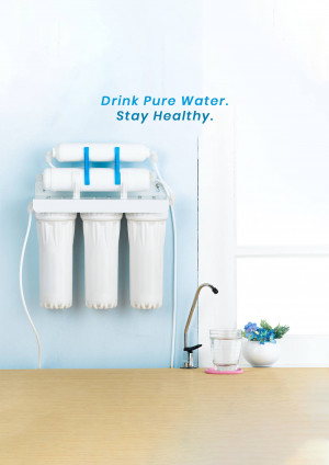 Wall-mounted water filter with a glass of water