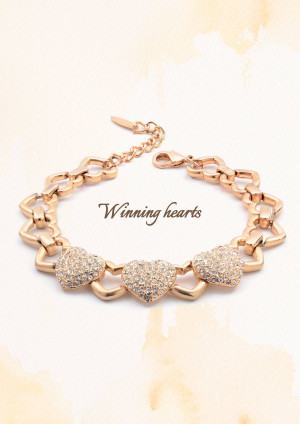 Close-up of a rose gold bracelet with heart-shaped charms