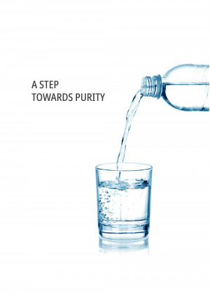 Water being poured from a bottle into a glass