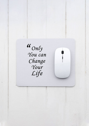 White mousepad with a motivational quote and a white computer mouse