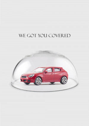 Red toy car under a clear glass dome, symbolizing insurance coverage.
