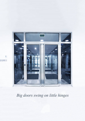 A modern building entrance with large glass doors.