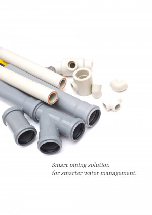 Assortment of grey and white PVC pipe fittings for plumbing