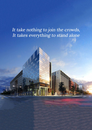 Modern glass office buildings at dusk with motivational quote