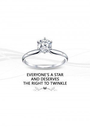 Close-up of a diamond engagement ring with the text 'Everyone's a Star and Deserves the Right to Twinkle'
