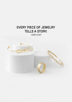 Minimalist jewelry display featuring gold bracelets and rings on white cylindrical pedestals.
