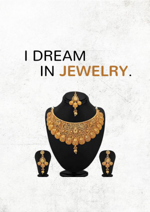 Close-up of a gold necklace and earring set on a black bust.
