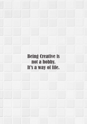 White tiled wall with text 'Being Creative is not a hobby. It's a way of life.'