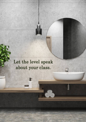 A stylish bathroom with a concrete wall, round mirror, and wooden vanity.