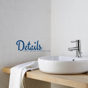 Close-up of a modern bathroom sink with a white towel and the word 'Details' in blue script.
