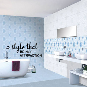 Elegant bathroom interior with patterned blue tiles, a white bathtub, and modern fixtures.