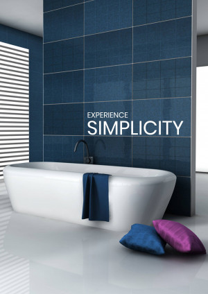 A modern bathroom featuring a white freestanding bathtub against a wall of blue tiles.