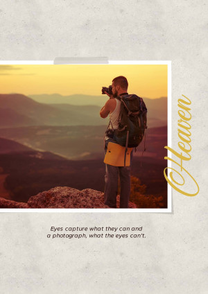 A photographer with a backpack standing on a mountain peak taking a picture of a landscape.