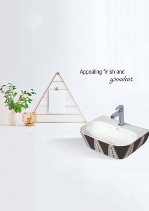 White and brown patterned bathroom sink with gold accents