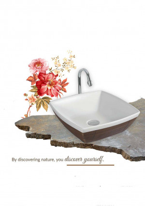 White square bathroom sink with red and pink floral arrangement on a stone surface