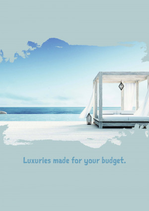 White canopy bed on a wooden deck overlooking a calm blue ocean.