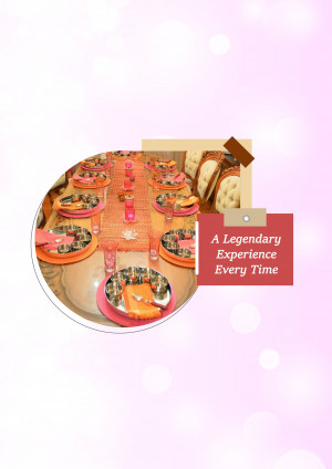 A beautifully set dinner table with orange and pink accents, ready for a special occasion.