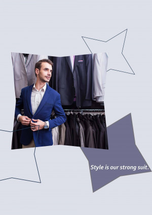A man in a blue suit adjusting his jacket in front of a rack of suits.