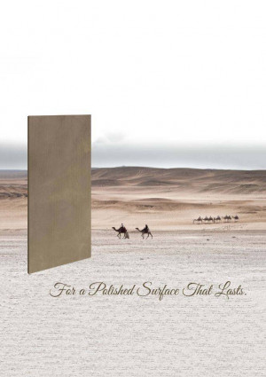 A stone slab positioned against a desert landscape with a camel caravan.