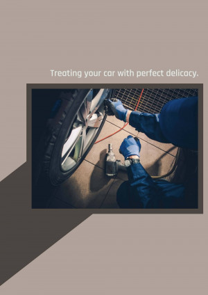 Close-up of a mechanic carefully cleaning a car wheel with a brush and cleaning solution.