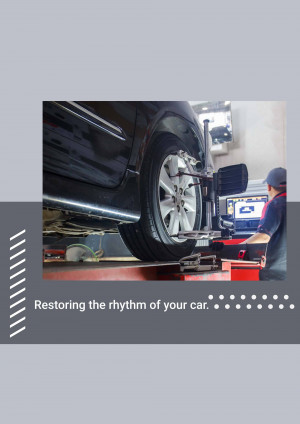 A mechanic performing a wheel alignment on a car.