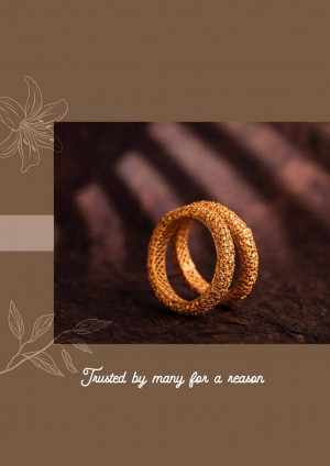Close-up of two golden bangles with a textured surface