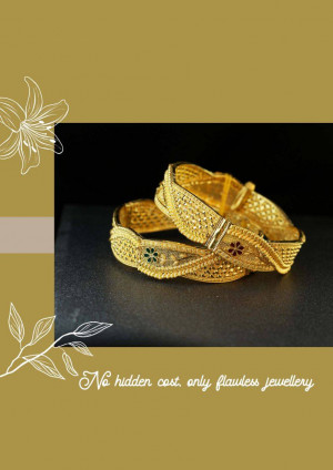 Close-up of two ornate gold bangles with floral design elements