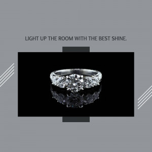 Close-up of a sparkling diamond ring on a black reflective surface