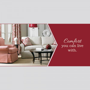 A well-decorated living room with a comfortable sofa and red accents.