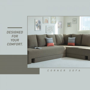 A large, comfortable corner sofa in a neutral color with decorative pillows.