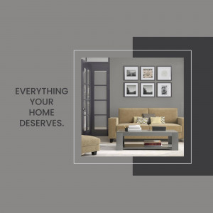 A stylish living room with a sofa, coffee table, and wall art.