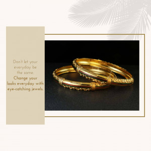 Close-up of two golden bangles with a black background and a motivational quote.