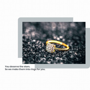 Close-up of a gold diamond ring on a dark, textured background.