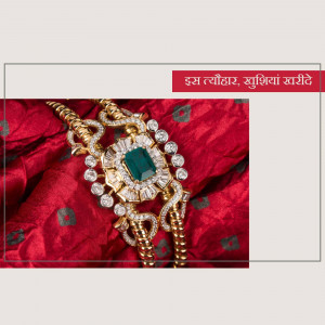 Close-up of a gold bracelet with a large emerald and diamond accents