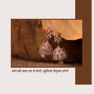 Close-up of ornate gold jhumka earrings with intricate diamond detailing