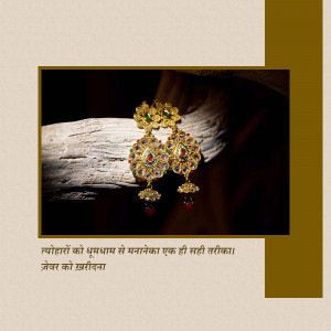 Close-up of ornate golden earrings with red and green gemstones resting on a piece of wood.
