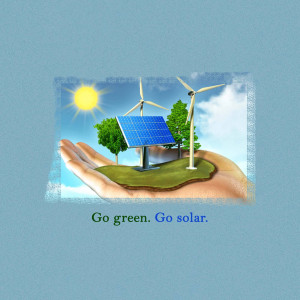 Hands holding a landscape with solar panels and wind turbines