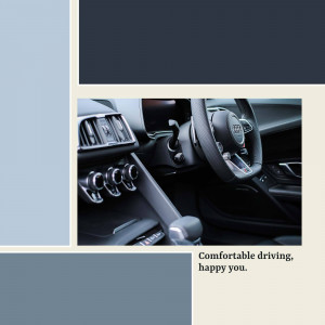 Close-up of an Audi car's interior, showing the steering wheel and dashboard.