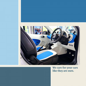Interior view of a blue and white Smart car with a focus on the dashboard and seats.