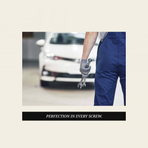 Mechanic working on a car with a wrench