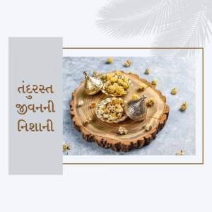 Close-up of Indian sweets served on a wooden slice with floral decorations