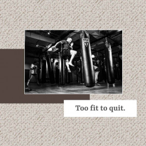 A black and white image of a boxer mid-air kick during a training session with punching bags.