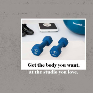 Fitness equipment including dumbbells, a phone, a scale, and a fitness ball with motivational text.