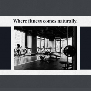 Black and white image of a modern gym interior with fitness equipment.