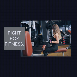 Woman working out at the gym using a cable machine.