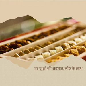 Close-up of a box filled with various Indian sweets, including barfi and ladoo.